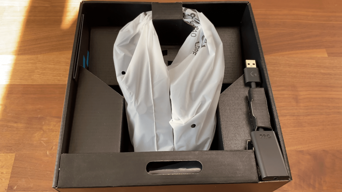 Opening the Pro X Box shows the headset wrapped and DAC beside it